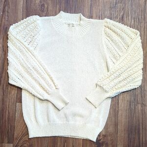 Elegant Cream Sweater with Textured Sleeves